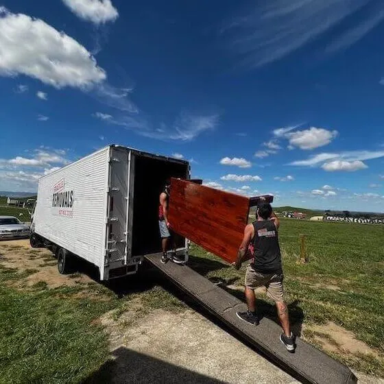 Moving truck transporting household furniture between Cambridge and Hamilton